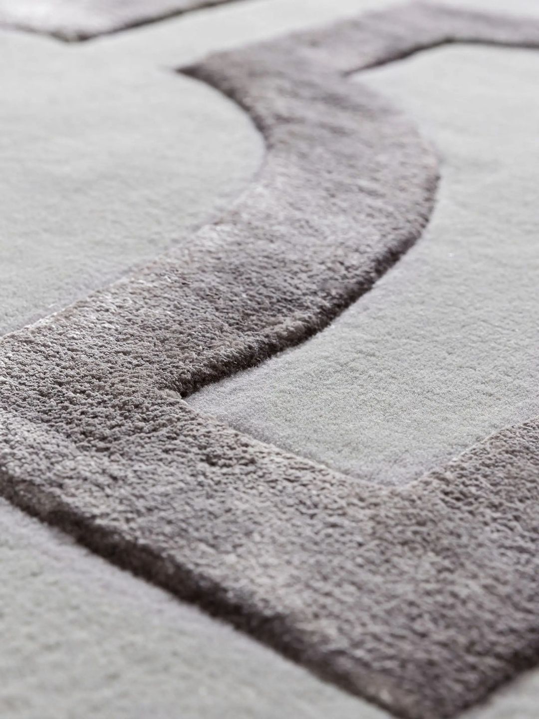 Crèmekleurig wollen vloerkleed woonkamerontwerp