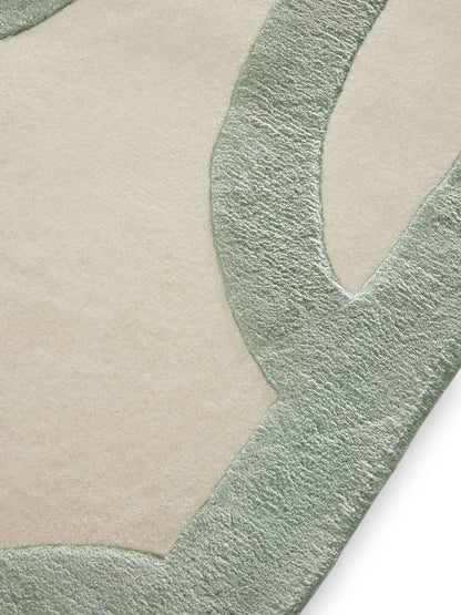 Crèmekleurig wollen vloerkleed woonkamerontwerp