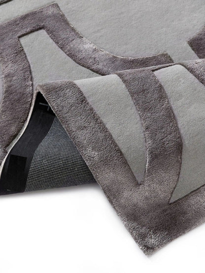 Crèmekleurig wollen vloerkleed woonkamerontwerp