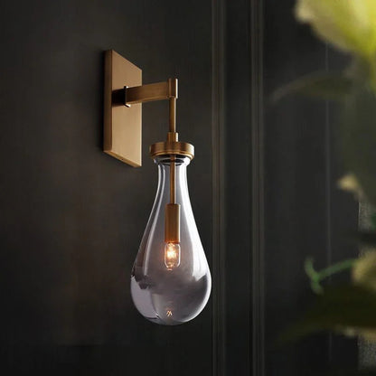 Wandlamp van traanvormig glas