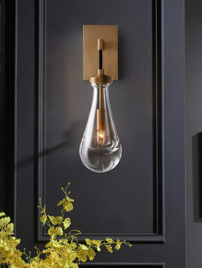 Wandlamp van traanvormig glas
