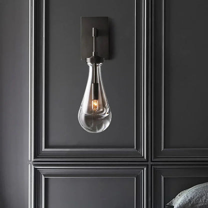 Wandlamp van traanvormig glas