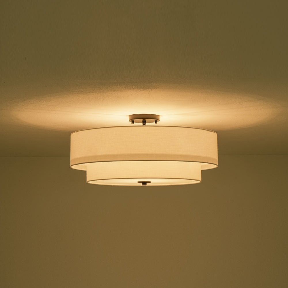 Half-inbouwlamp met witte linnen kap in trommelvorm