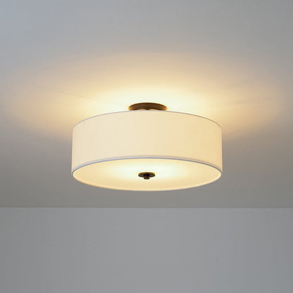 Half-inbouwlamp met witte linnen kap in trommelvorm