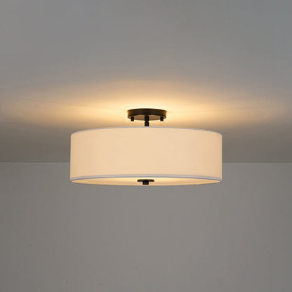 Half-inbouwlamp met witte linnen kap in trommelvorm