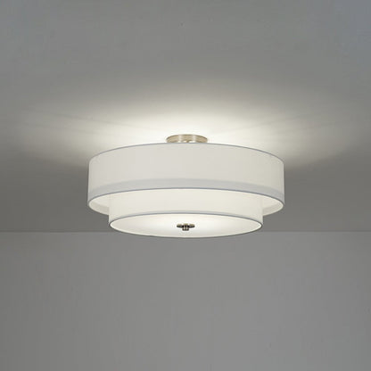 Half-inbouwlamp met witte linnen kap in trommelvorm