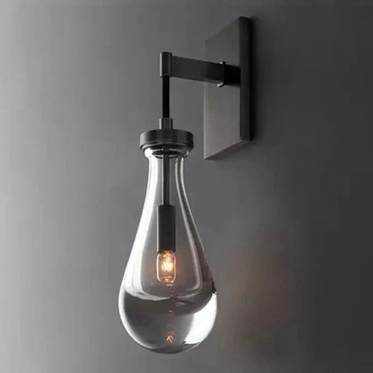 Wandlamp van traanvormig glas